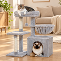 Petit arbre à chat avec hamac et niche dans son décor