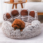 Chien dans le coussin respirant en forme de patte